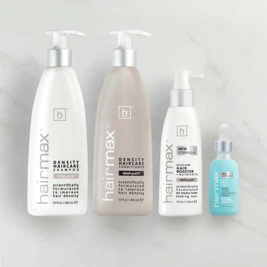 Collection of Hairmax hair care products on a light gray background